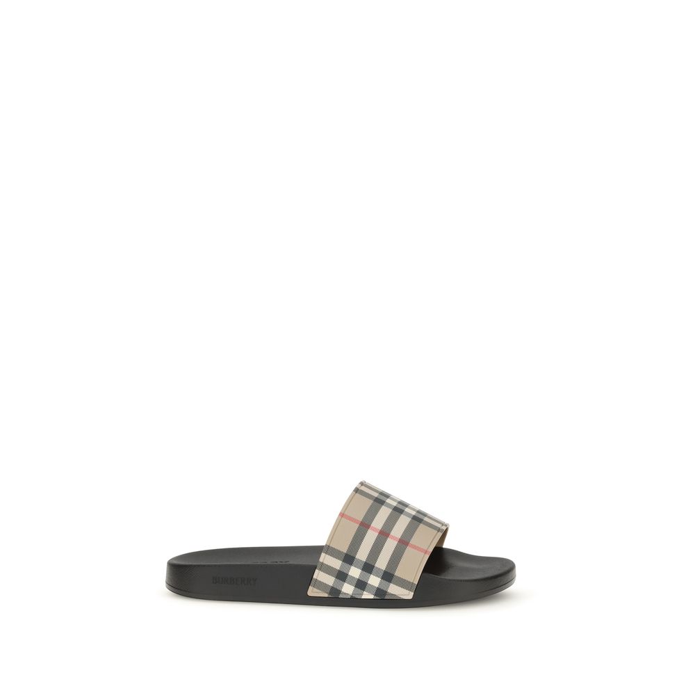 Burberry juodos guminės įspiriamos šlepetės Burberry juodos guminės įspiriamos šlepetės